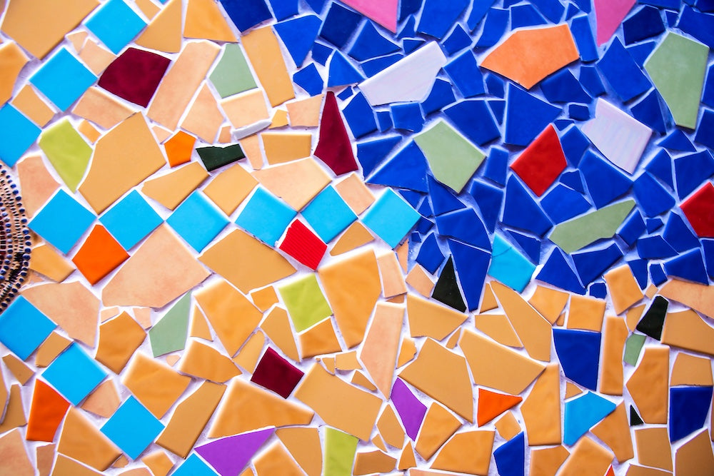Close up image of mosaic artwork with bright colours depicting a scene